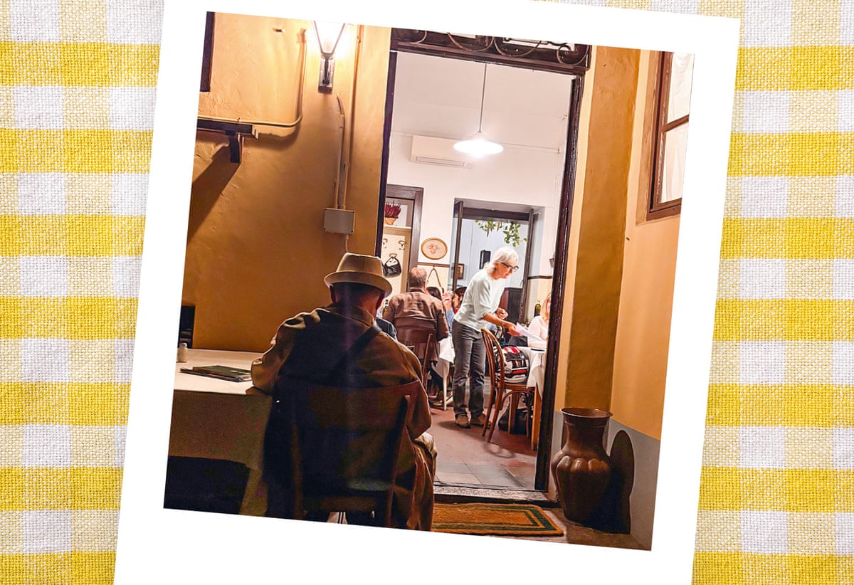 Man sitting with back to camera in a restaurant