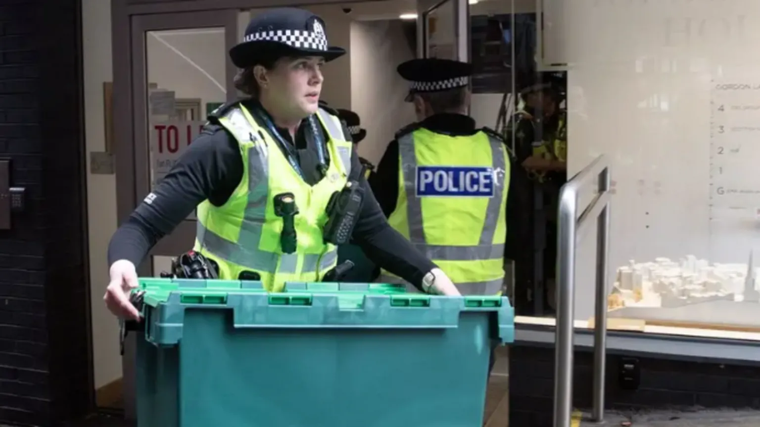 Police bring out boxes from SNP HQ