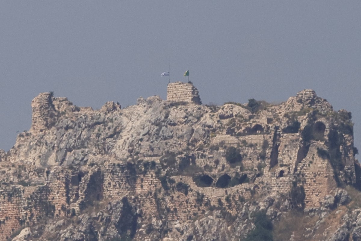 An Israeli flag and a Golani Brigade flag fluttering atop the medieval Beaufort Castle in Arnoun.