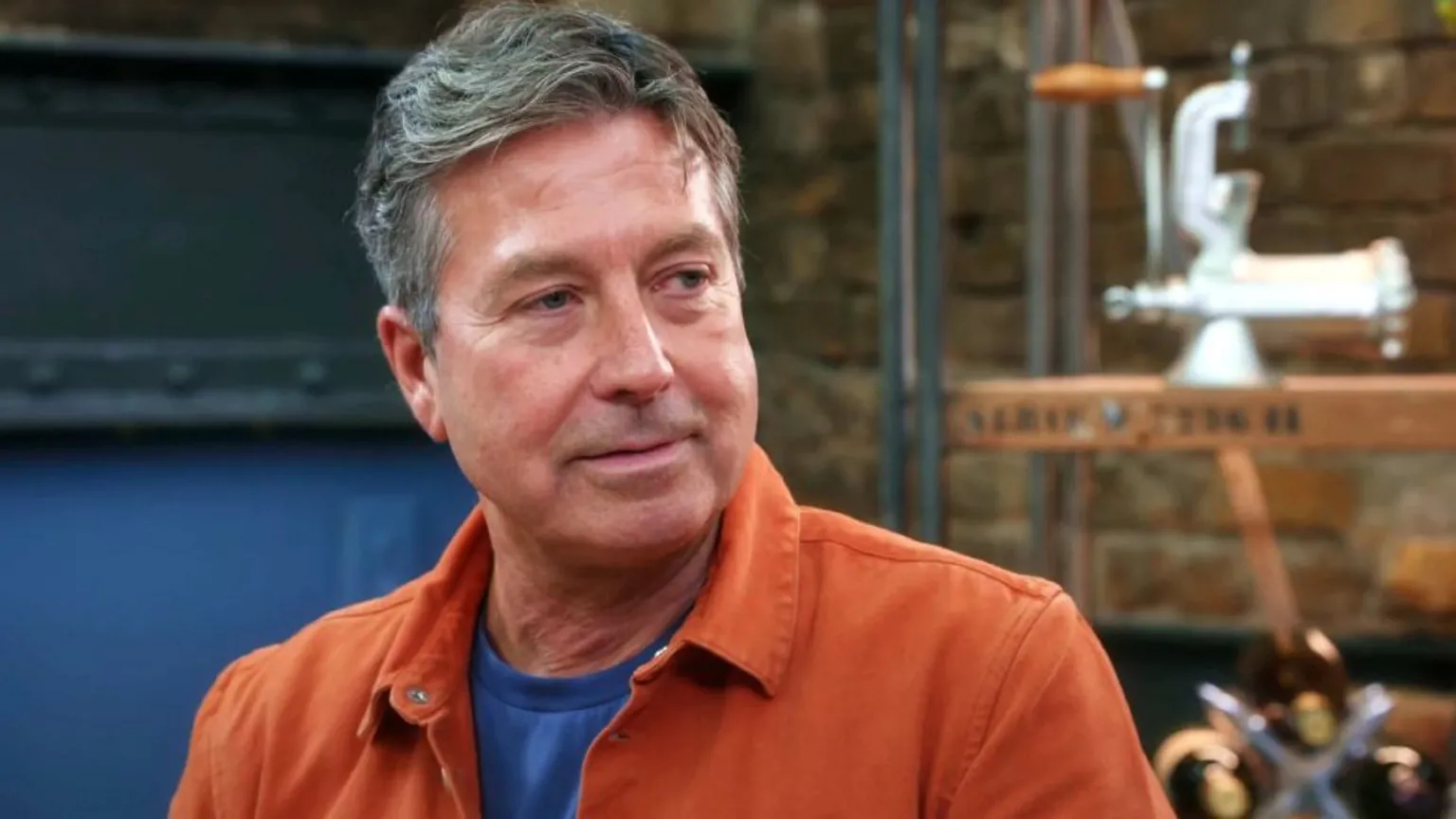 BBC/Shine TV John Torode pictured on series 19 of Masterchef, wearing an orange shirt