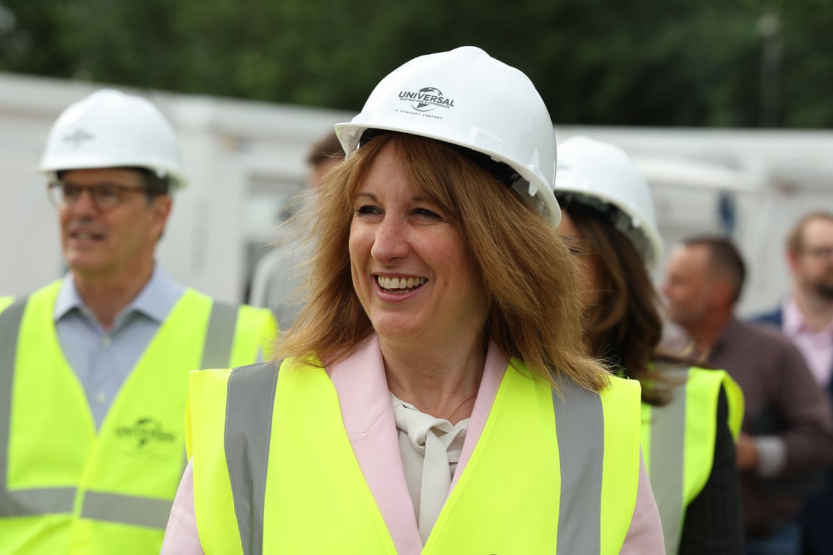 Rachel Reeves smiling in hard hat and hi-vis jacket