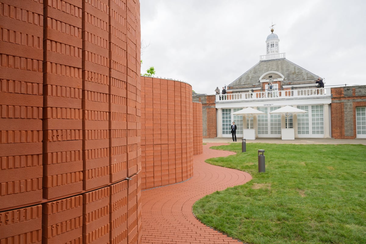 Red brick undulating wall with a lawn following the same shape