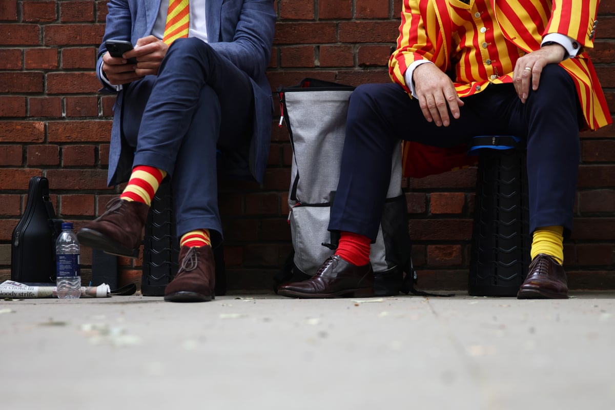MCC members show off their distinctive socks outside the ground