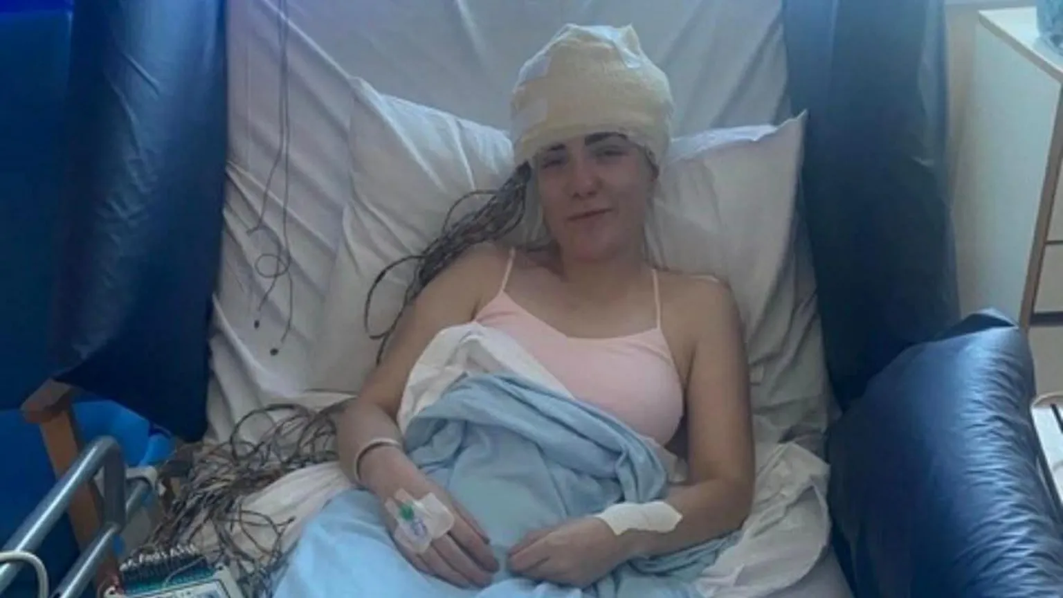 Sophie Morgan Sophie Morgan sits in a hospital bed. Her head is heavily bandaged, and she has lots of wires coming from her head. She wears a pink strappy vest and has a blue blanket pulled over her stomach.