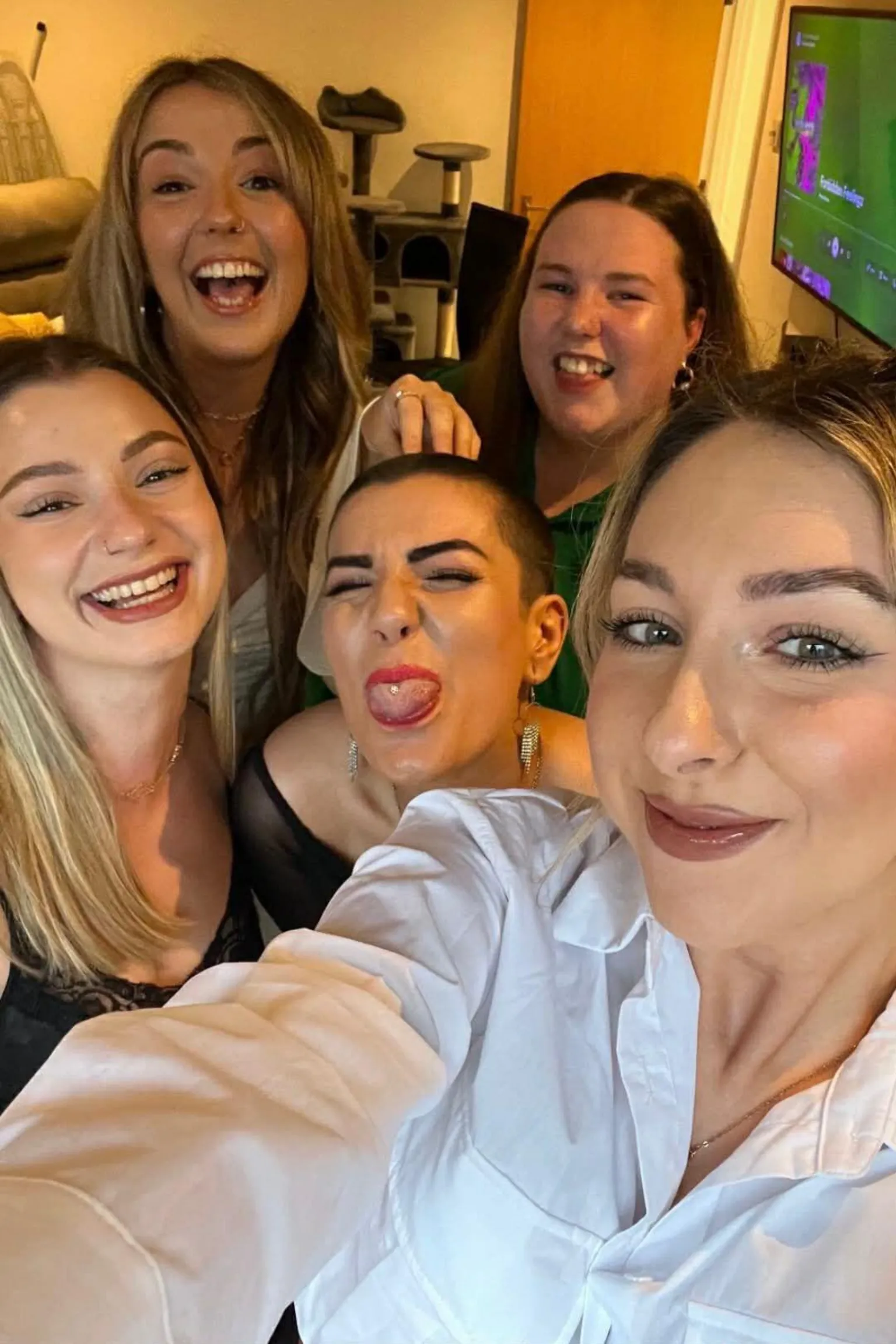 Sophie Morgan Sophie Morgan (centre) poses with four of her friends. She pokes her tongue out while the rest of her friends smile at the camera. 