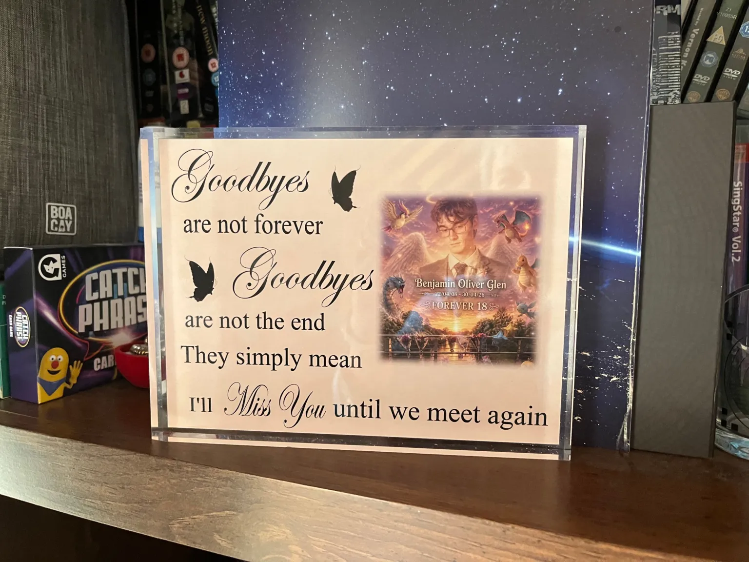 An ornament with a picture of Ben Glen on it. It says Goodbyes are not forever. Goodbyes are not the end. They simply mean I'll miss you until we meet again.