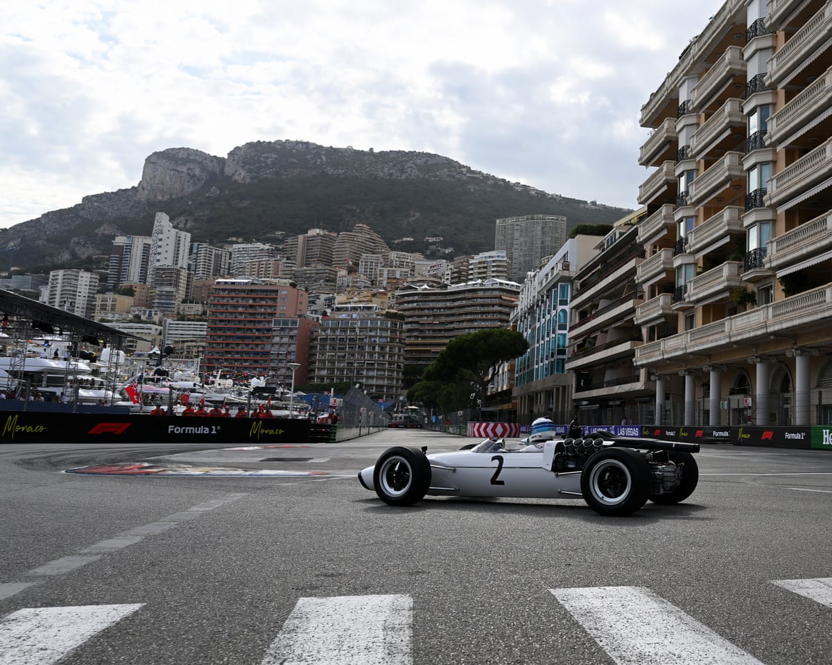 Mika Häkkinen drives in McLaren’s first car, the M2B, with the view of the Monte Carlo central ward behind him during previews ahead of the F1 Monaco Grand Prix