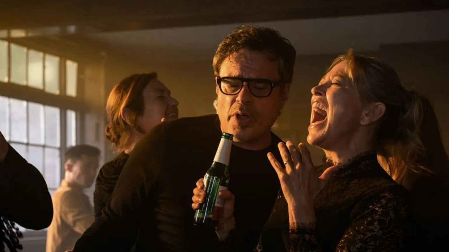 Disney Jemaine Clement and Nicola Walker as Steve and Alice singing holding a beer bottle 