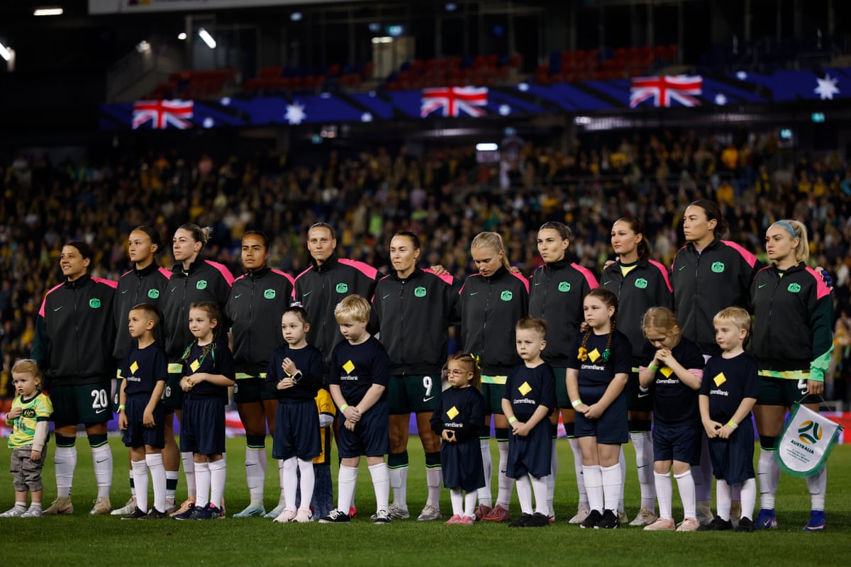The Matildas line up for the national anthem