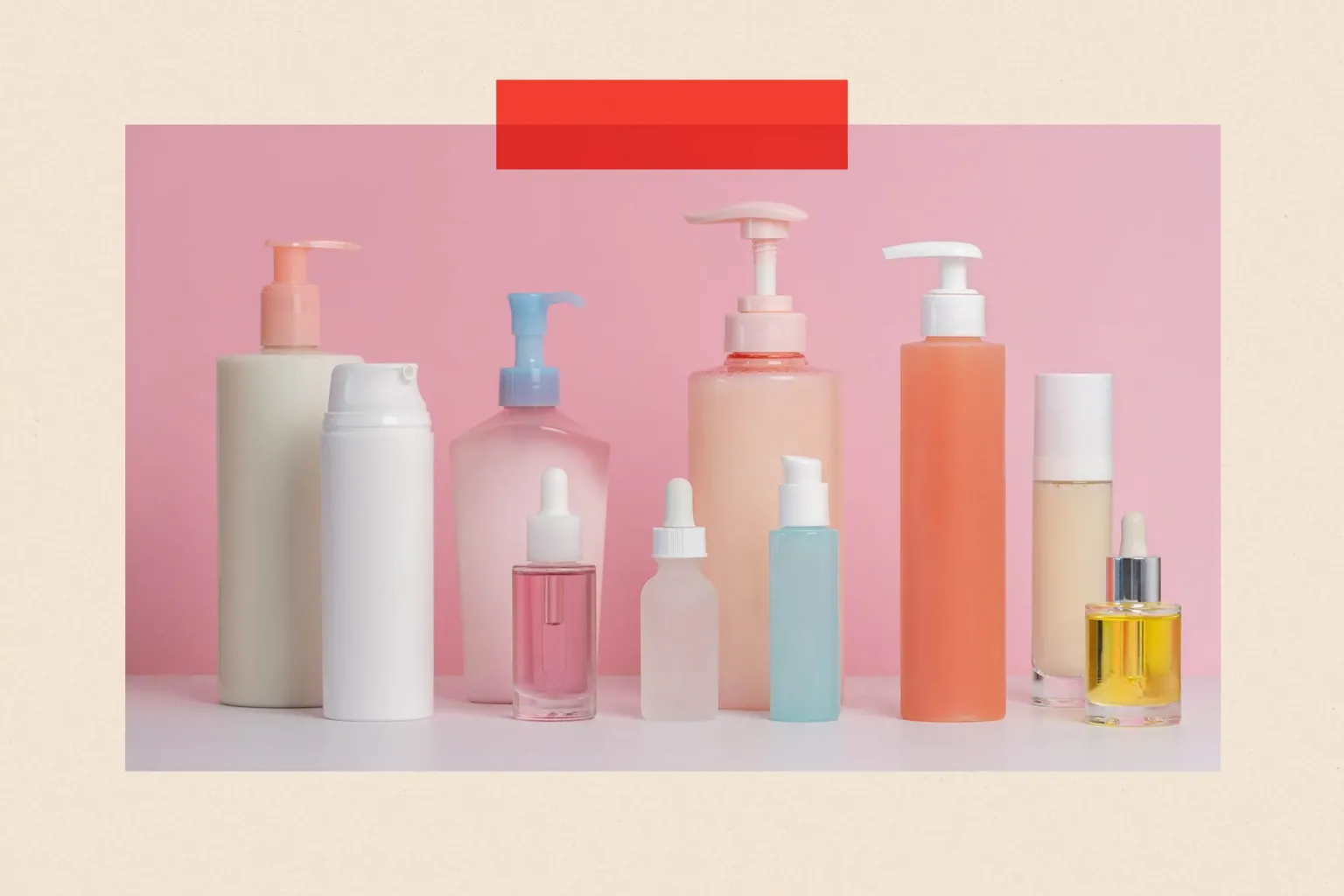  Various skincare bottles on pink background 