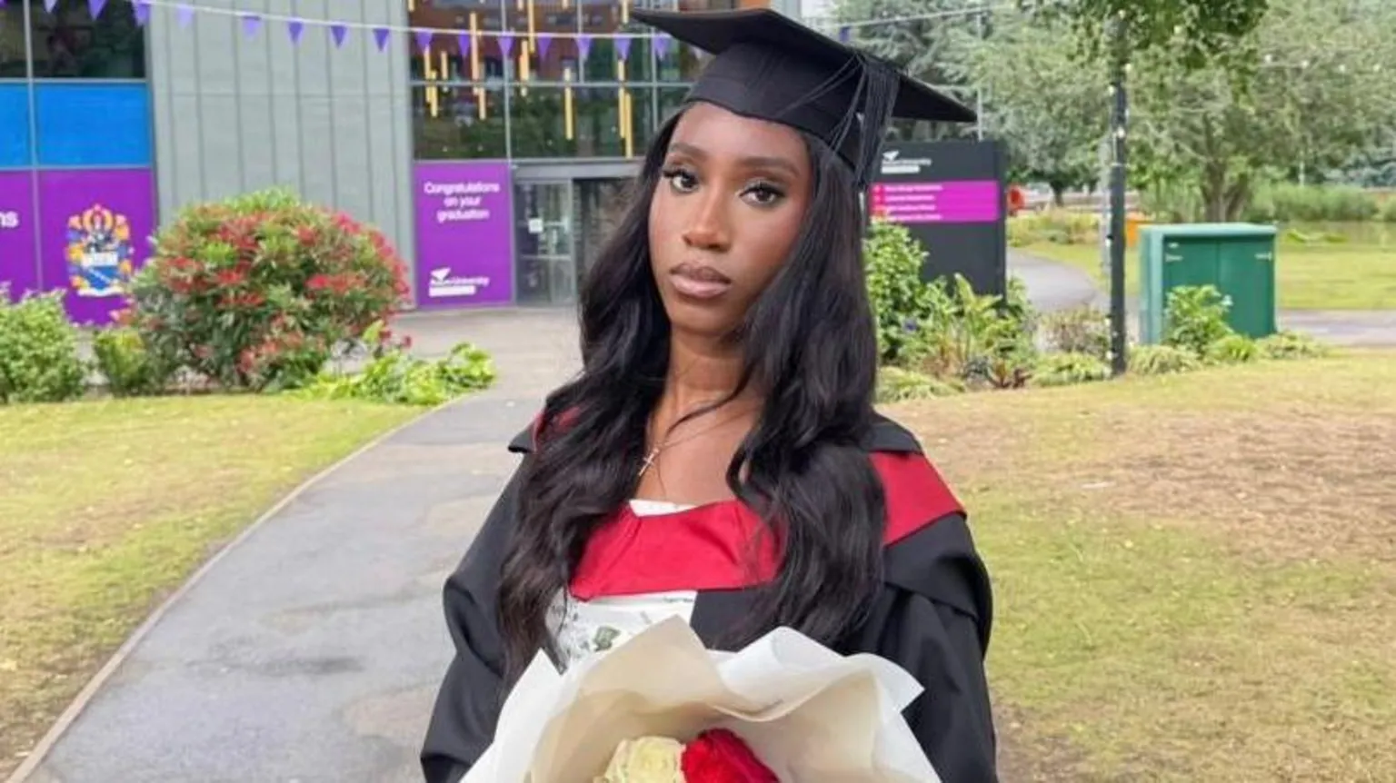 Theresa Theresa is wearing a cap and gown at her Aston University graduation.