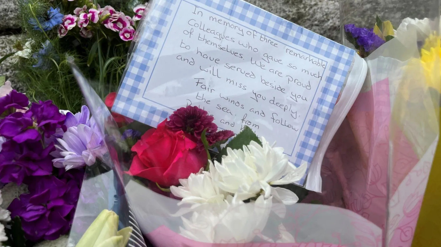 Floral tributes with a written message left outside All Saints Church in Okehampton on Sunday afternoon.