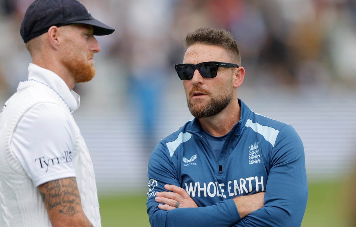 England captain Ben Stokes talks to his head coach Brendon McCallum