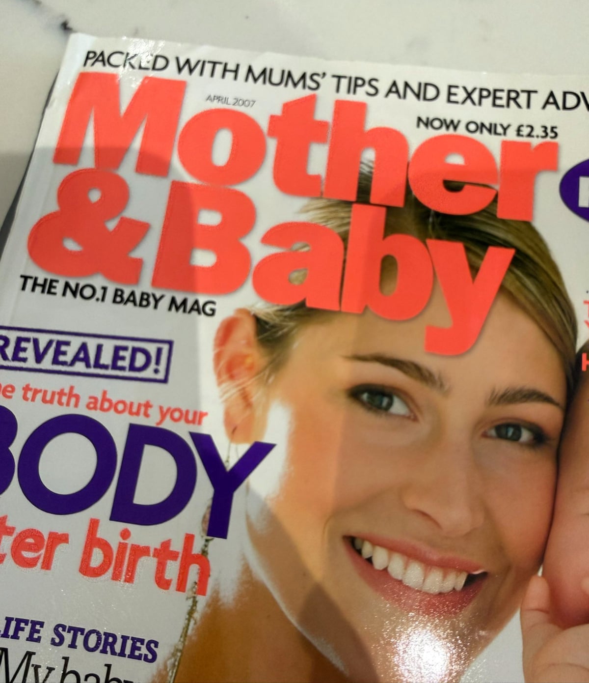 A copy of Mother & Baby magazine from 2007, with a smiling mother on the cover
