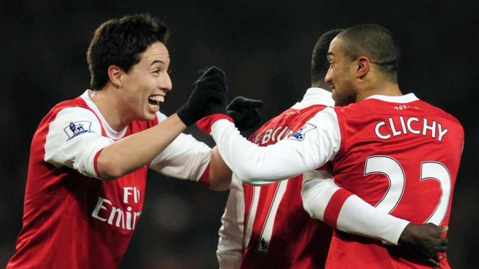 Gael Clichy celebrates with team-mate Samir Nasri after scoring for Arsenal