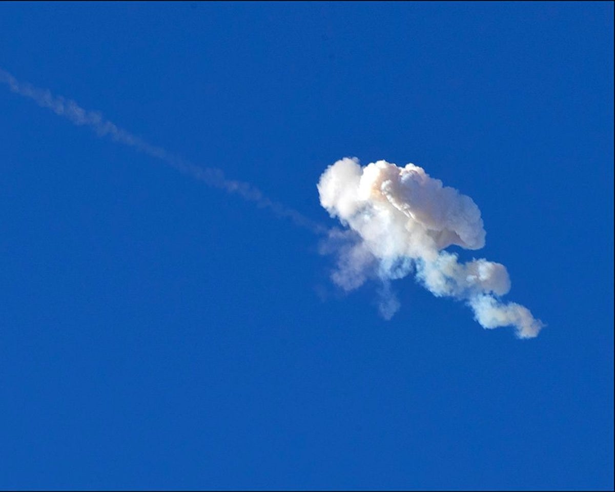An Israeli interceptor strikes an Iranian ballistic missile over the Jerusalem area on Monday