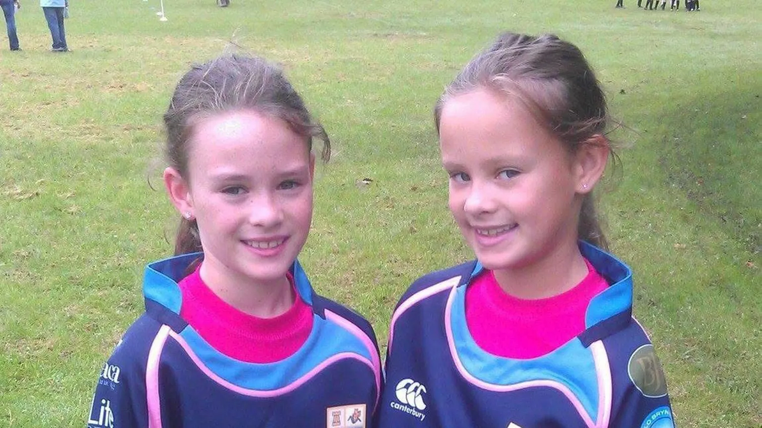 Ffion Jones An old image showing Ffion and Celyn standing on a field smiling at camera in rugby kit. 