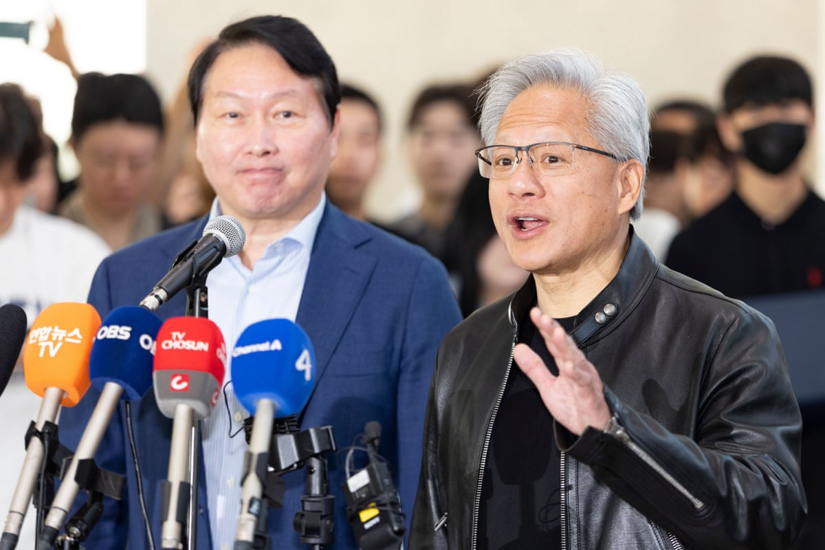 Jensen Huang, right, CEO of Nvidia, speaks alongside Chey Tae-won, left, chairman of SK Group, during a media briefing on AI and semiconductor cooperation between NVIDIA and SK Group.