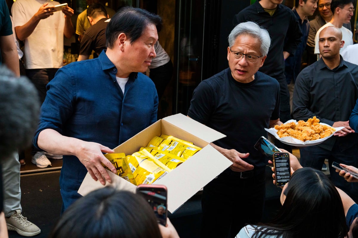 Nvidia founder and CEO Jensen Huang and SK Group chairman Chey Tae-Won taking questions from reporters at Kkanbu Chicken on Sunday