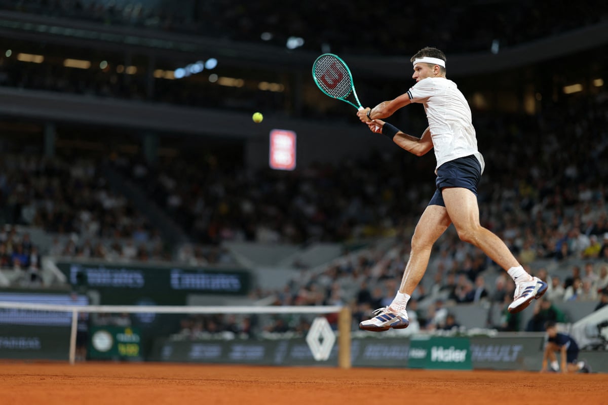 Czech Republic's Jakub Mensik plays a backhand return to Brazil's João Fonseca during their men's quarter final