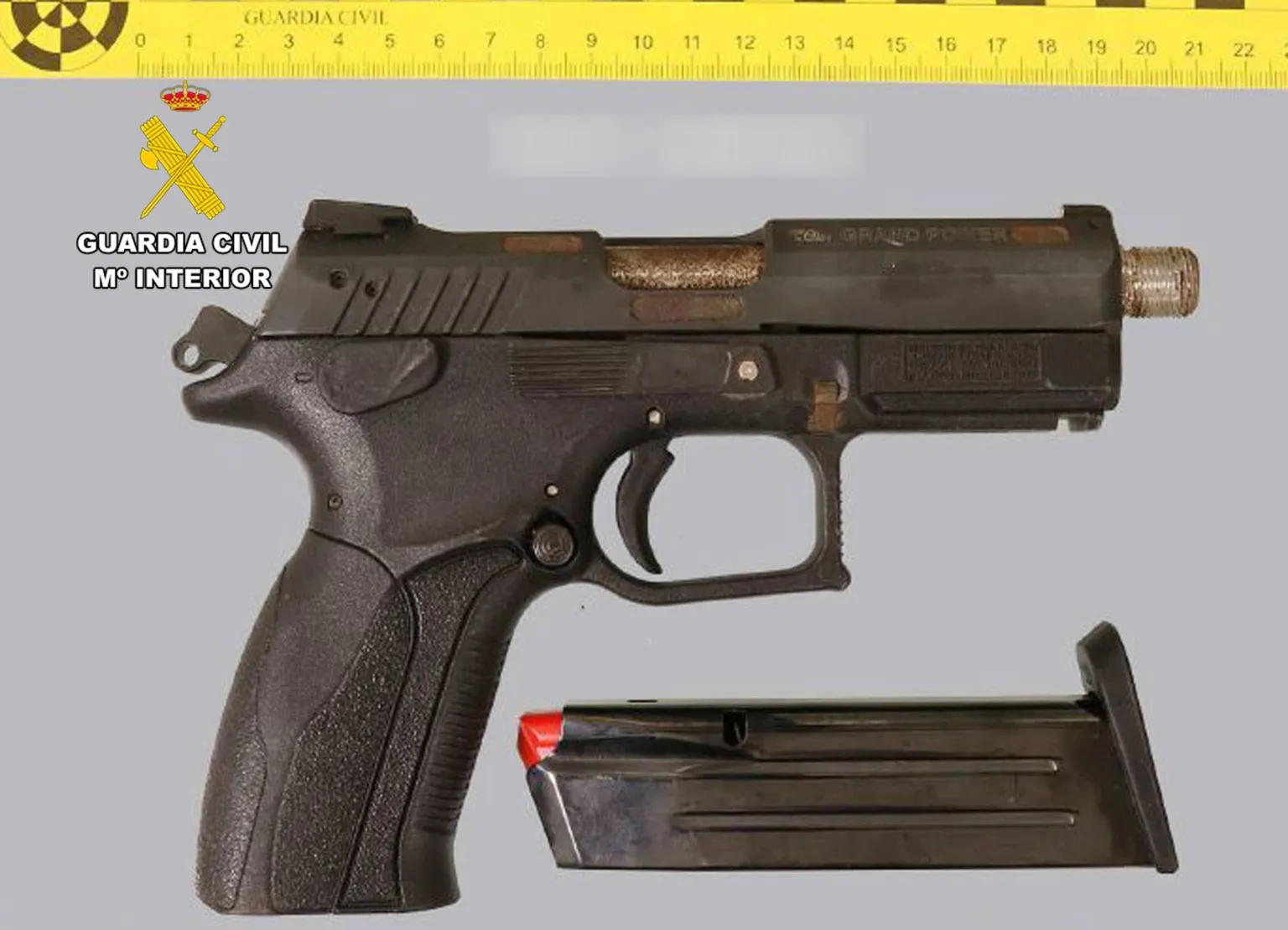 Civil Guard A police photograph of a handgun with a silencer.
