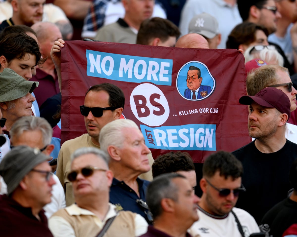 West Ham fans hold up a banner in the club’s colours that reads ‘No more BS. Just resign’