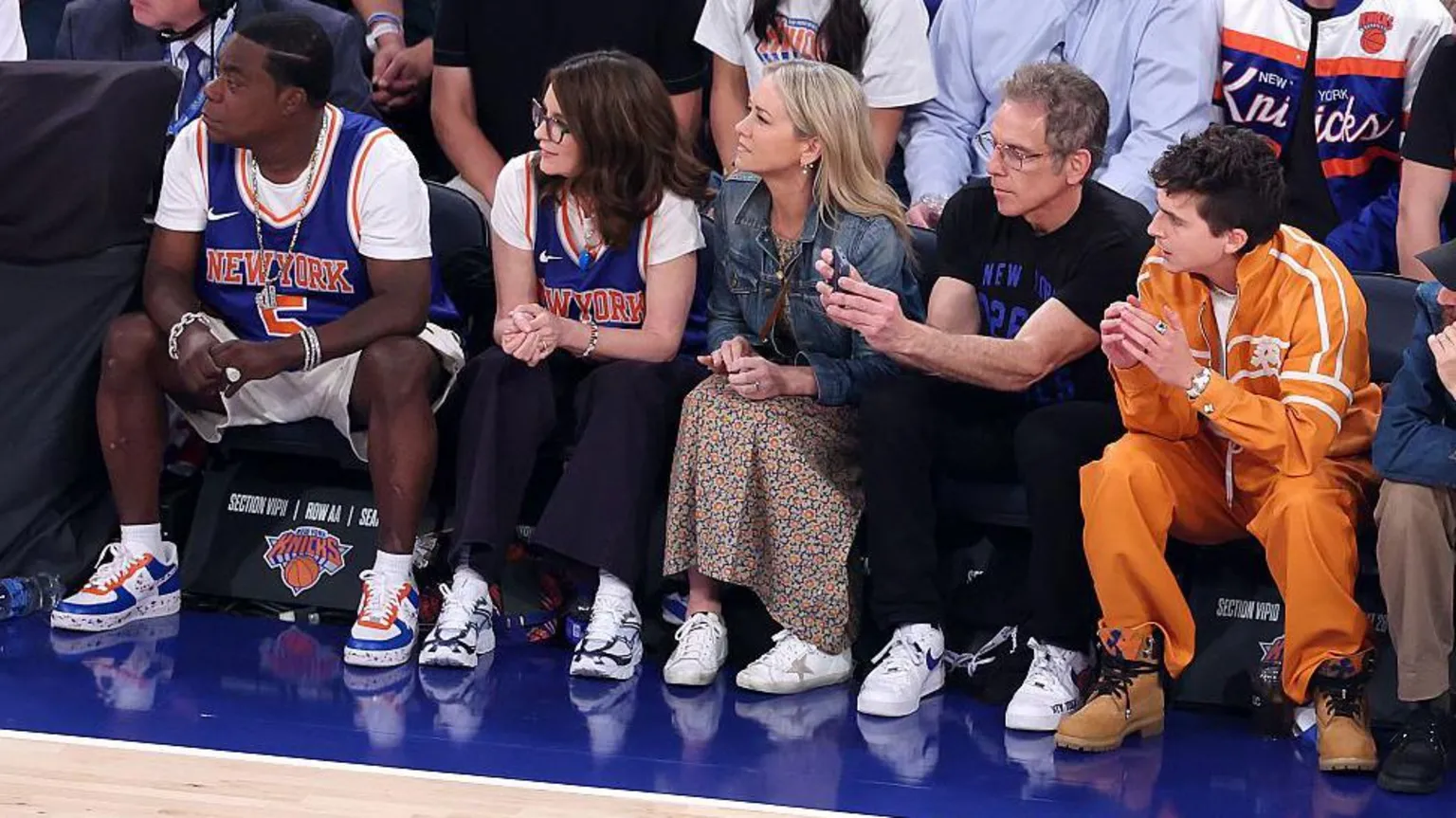 Al Bello/ From left to right: actors Tracy Morgan, Tina Fey, Christine Taylor, Ben Stiller and Timothée Chalamet watch a basketball match between the New York Knicks and the San Antonio Spurs at Madison Square Garden in New York City. Photo: 8 June 2026