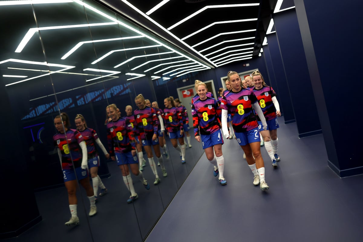 Keira Walsh, Maya Le Tissier, Lauren Hemp and their England teammates walk through the tunnel as they head to the pitch for the warm up.