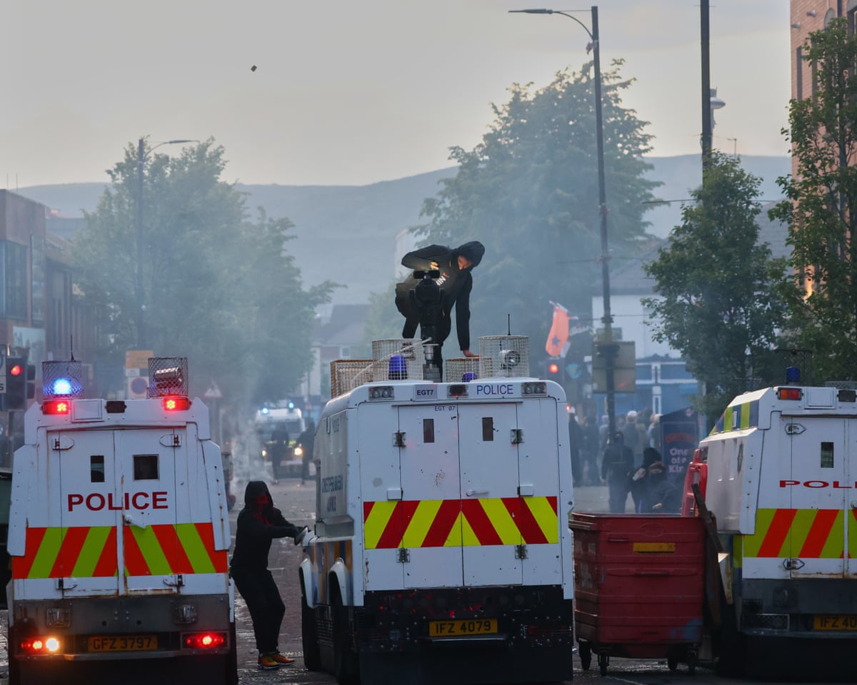 Protesters attacking a police van