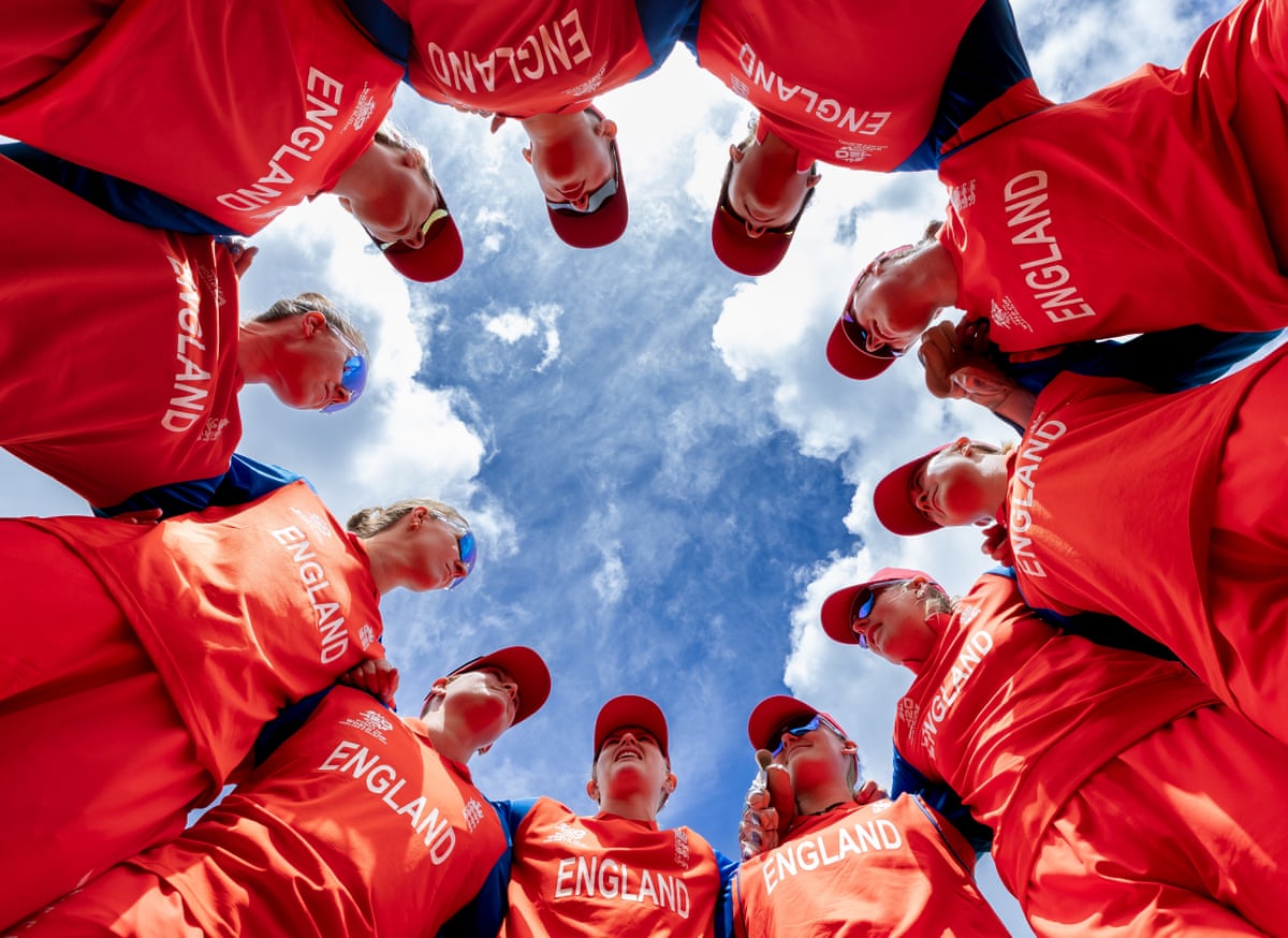 Charlie Dean of England speaks to teammates in a huddle during the T20 World Cup warm-up match between England and India.