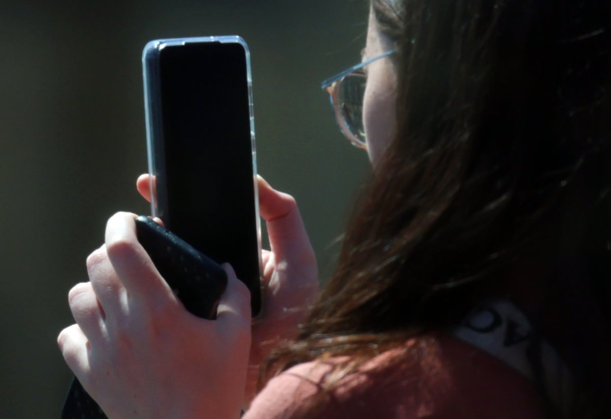 Teenager using a smartphone