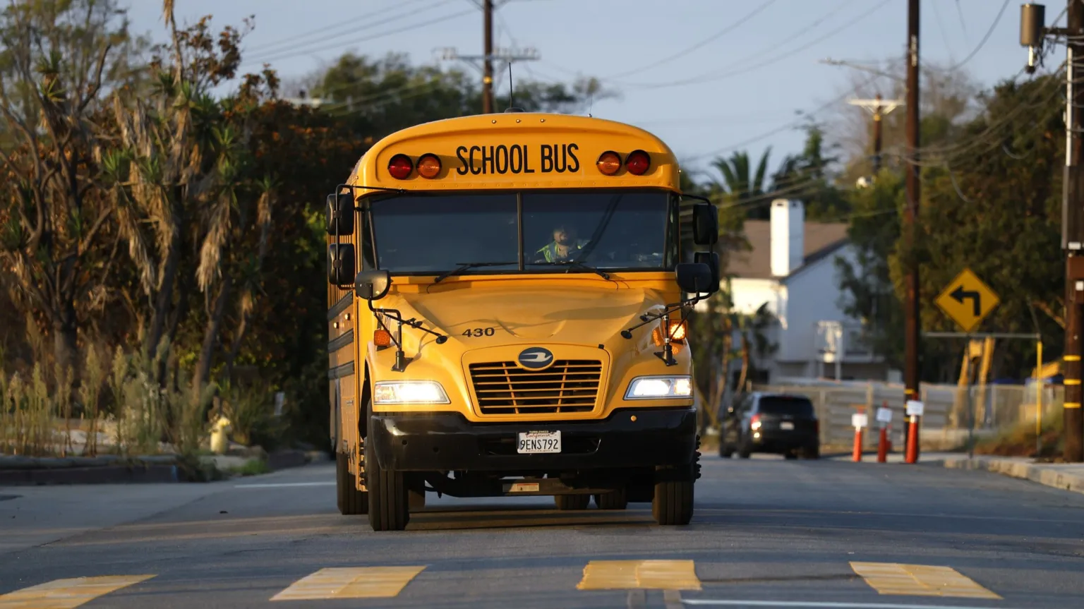 A school bus in California approaches a crossing