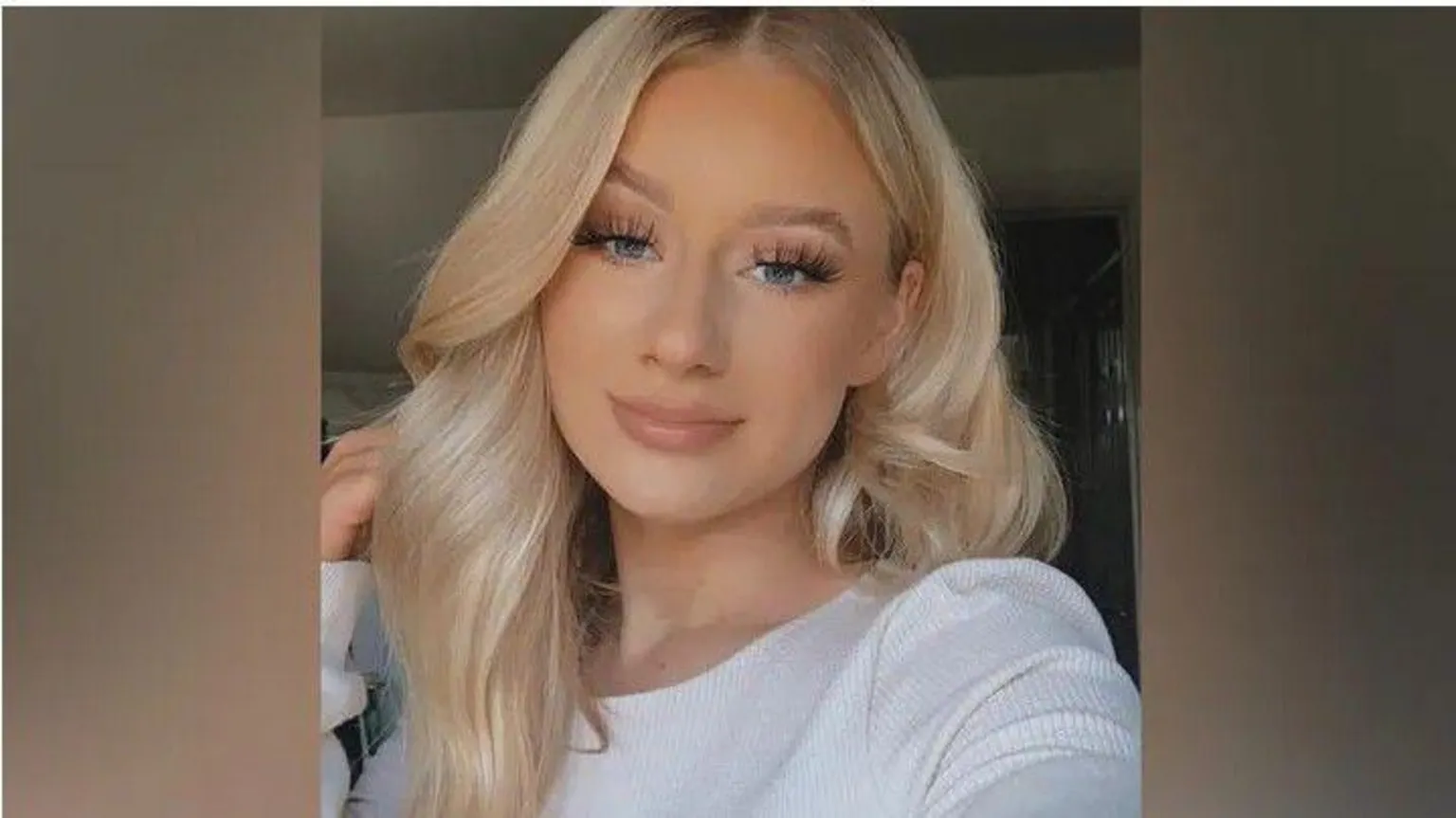 Facebook Lucy Harrison, who has long blonde hair resting on top of her head, smiles at the camera.