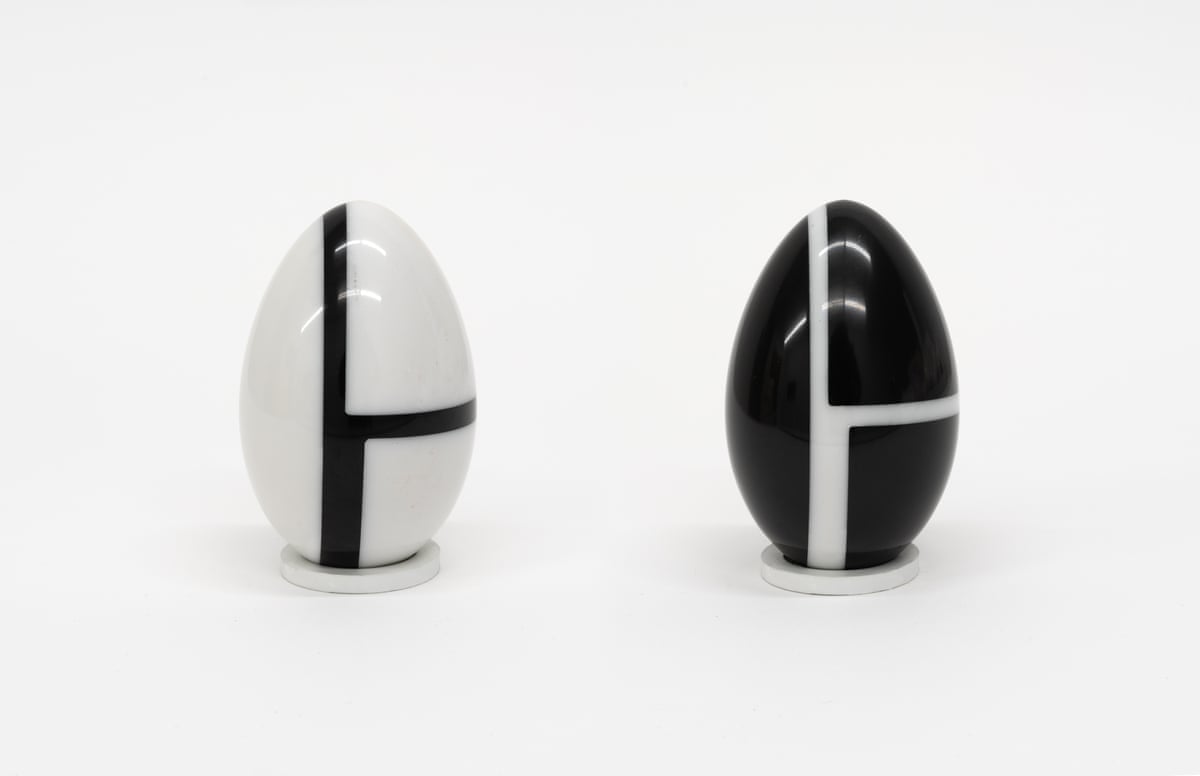 Two black and white marble egg sculptures.
