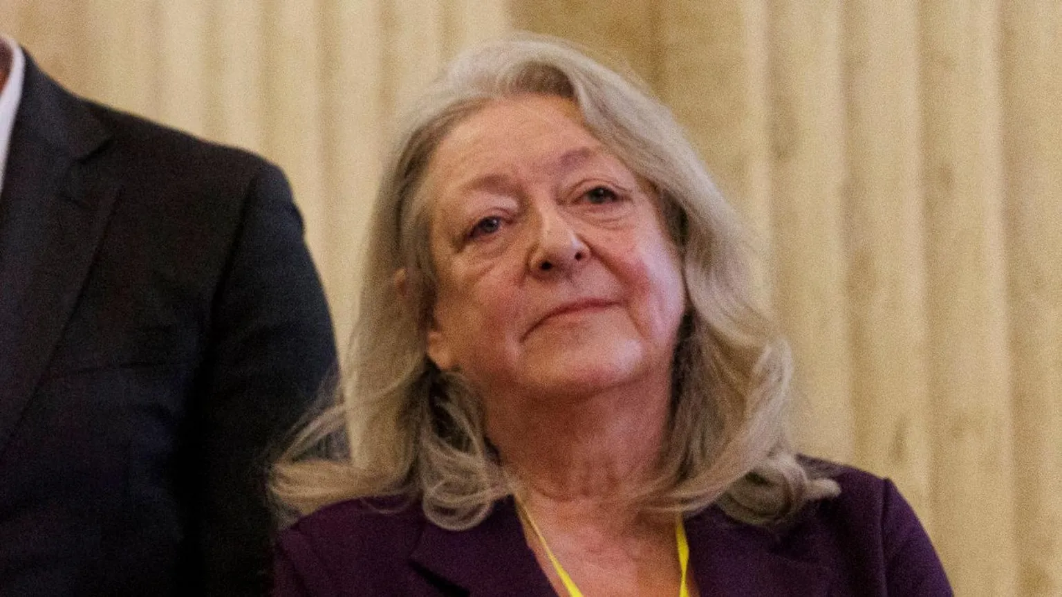  Patricia McKeown. She has long blonde hair, wearing a dark blazer.