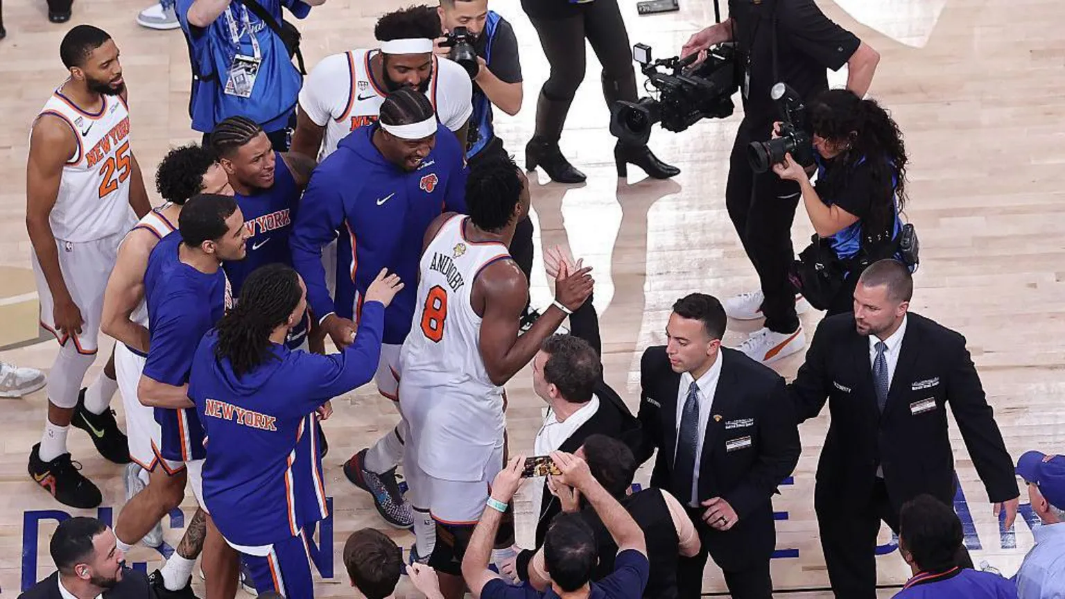 OG Anunoby #8 of the New York Knicks celebrates with teammates after their 107-106 victory against the San Antonio Spurs in Game Four of the 2026 NBA Finals at Madison Square Garden.