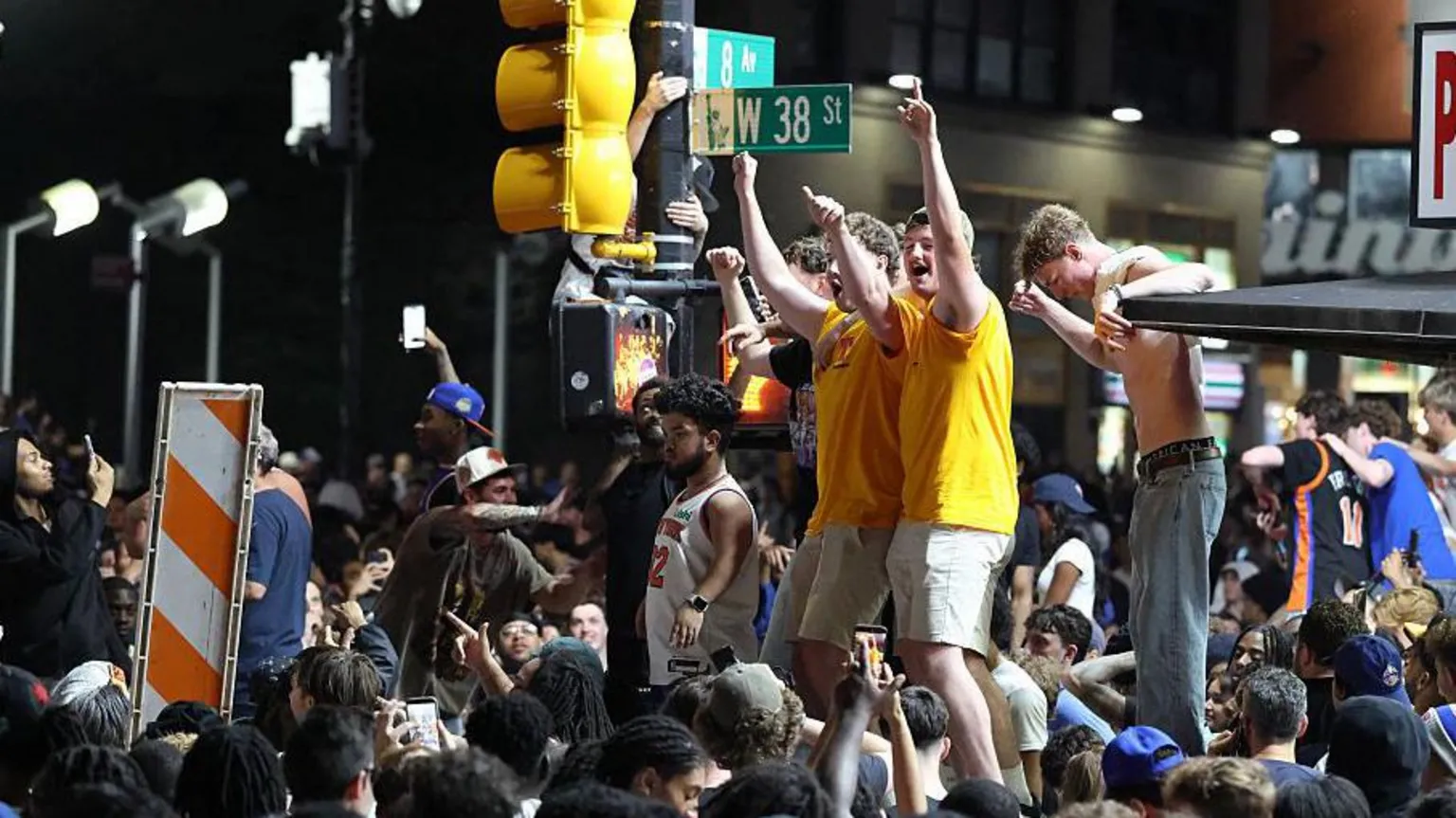 New York Knicks fans celebrate outside Madison Square Garden after their team's Game 4 victory.