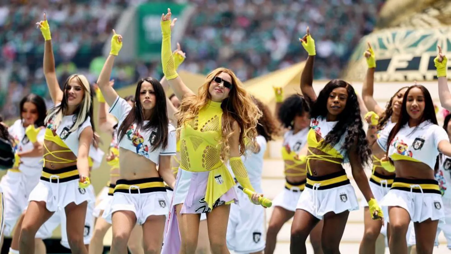 Shakira performs with dancers