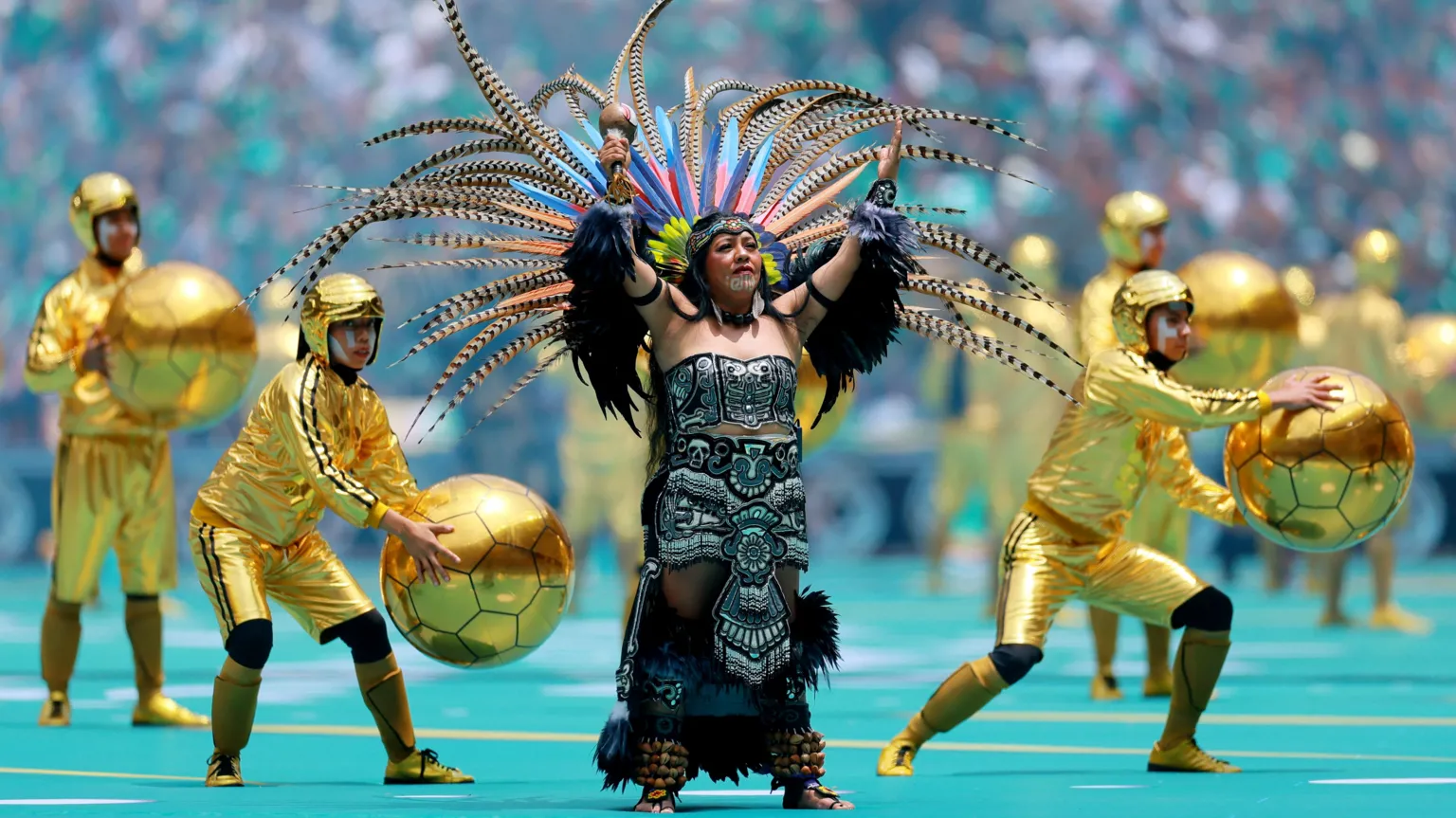 Performers during the opening ceremony before the match