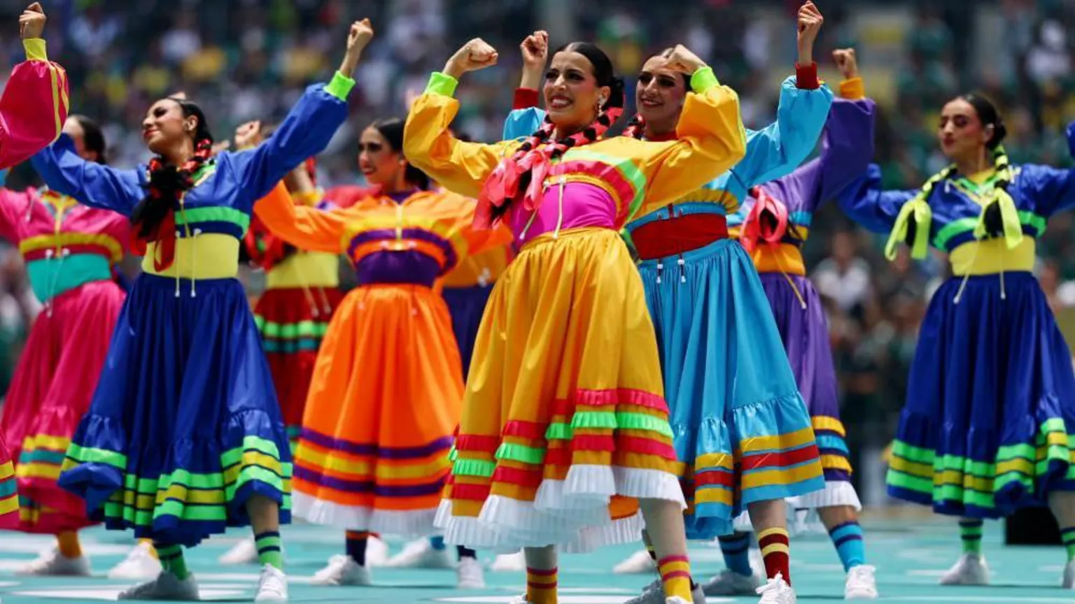 Dancers in colourful traditional Mexican dresses perform at the opening ceremony.