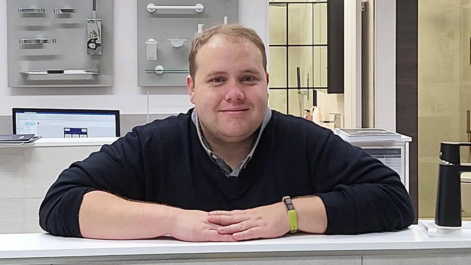 Mark Fullilove Man with blonde hair leaning on a counter with his hands and arms 