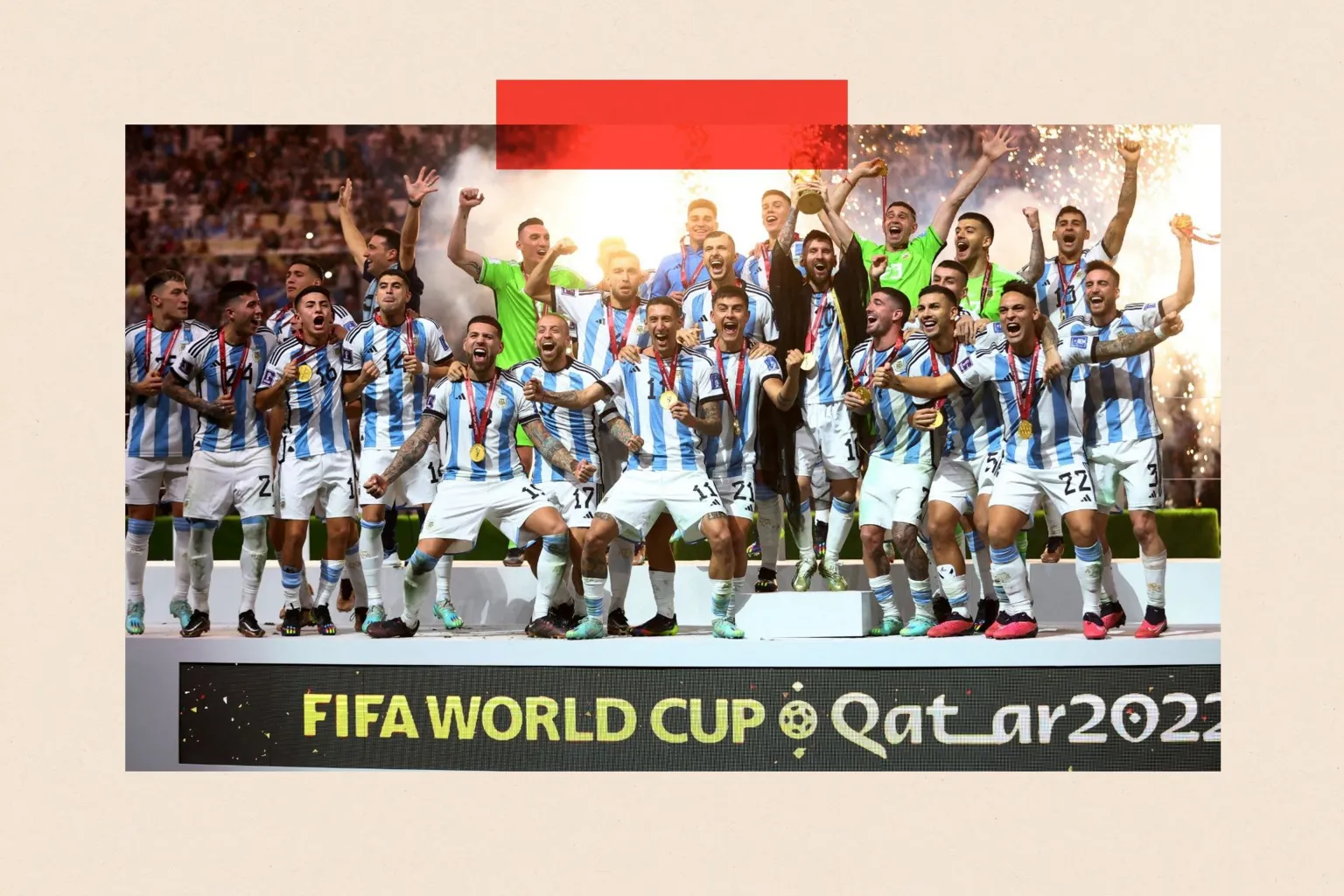 Lionel Messi celebrates with the trophy and team mates after winning the World Cup