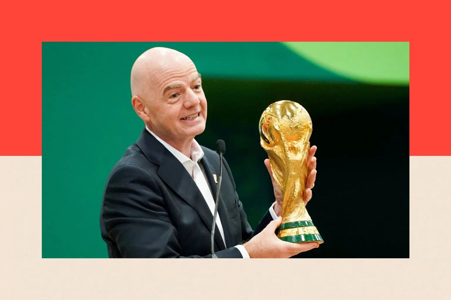 IMAGN IMAGES/ Connect FIFA President Gianni Infantino holds the World Cup trophy while he speaks