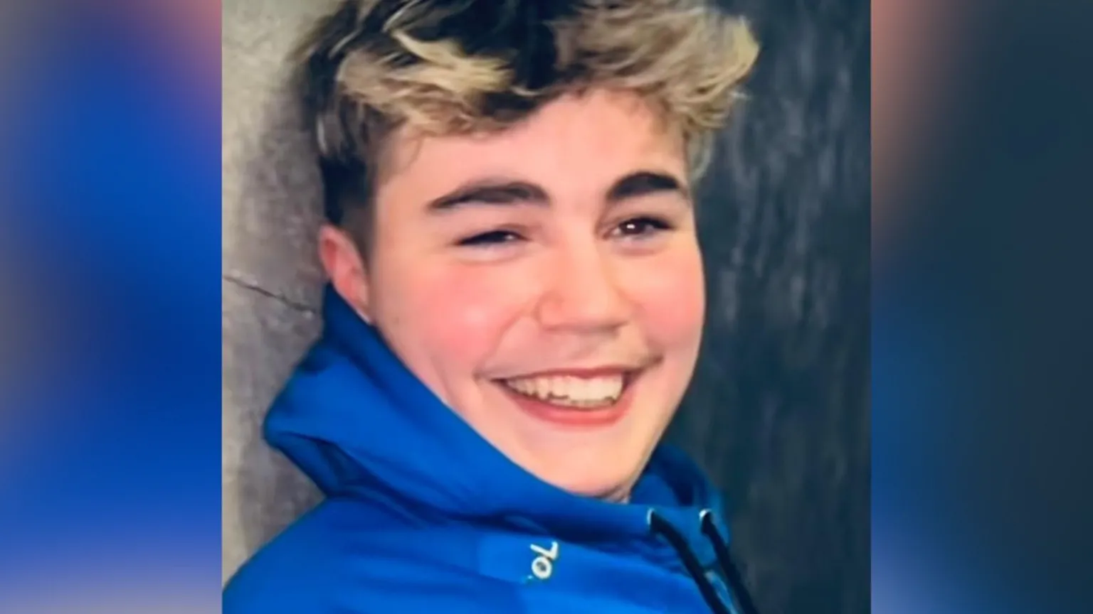 Family handout A young man with dark hair and blonde highlights. He is wearing a bright blue hooded jacket.