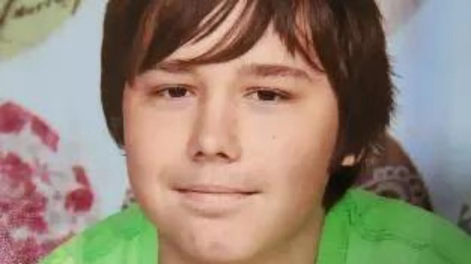 Family/Samart funeral home A man smiling looking at the camera. He is wearing a green T-shirt and has brown hair.