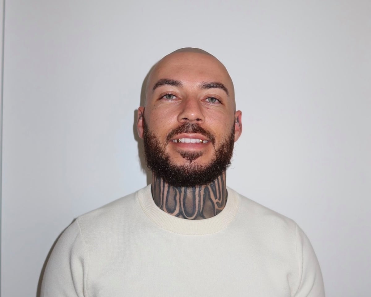 Jordan Hindmarsh-Keevil in a white T-shirt, smiling at the camera