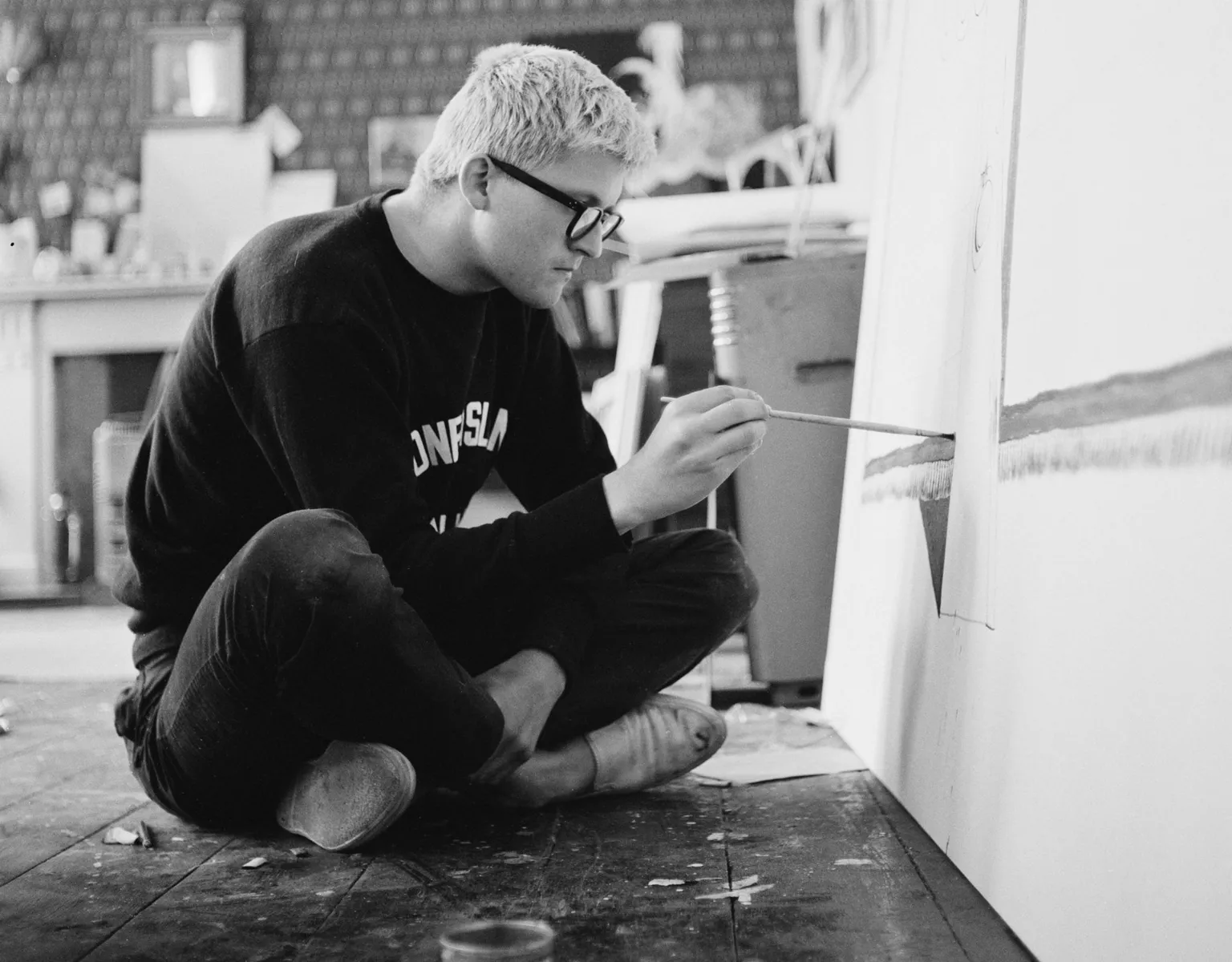 English artist David Hockney working in a studio, circa 1967.