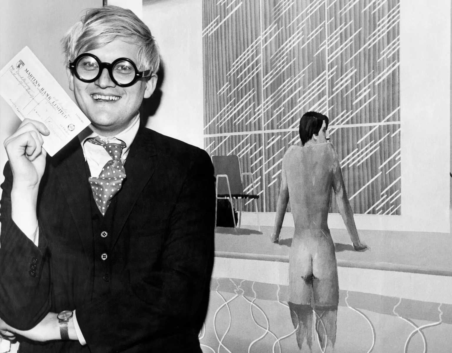 Winner of this years 1500 first prize in the sixth John Moores Liverpool Exhibition is thirty-year-old David Hockney with his painting 'Peter Getting out of Nick's Pool'. He is pictured with his painting at the Walker Art Gallery in Liverpool, 21st November 1967