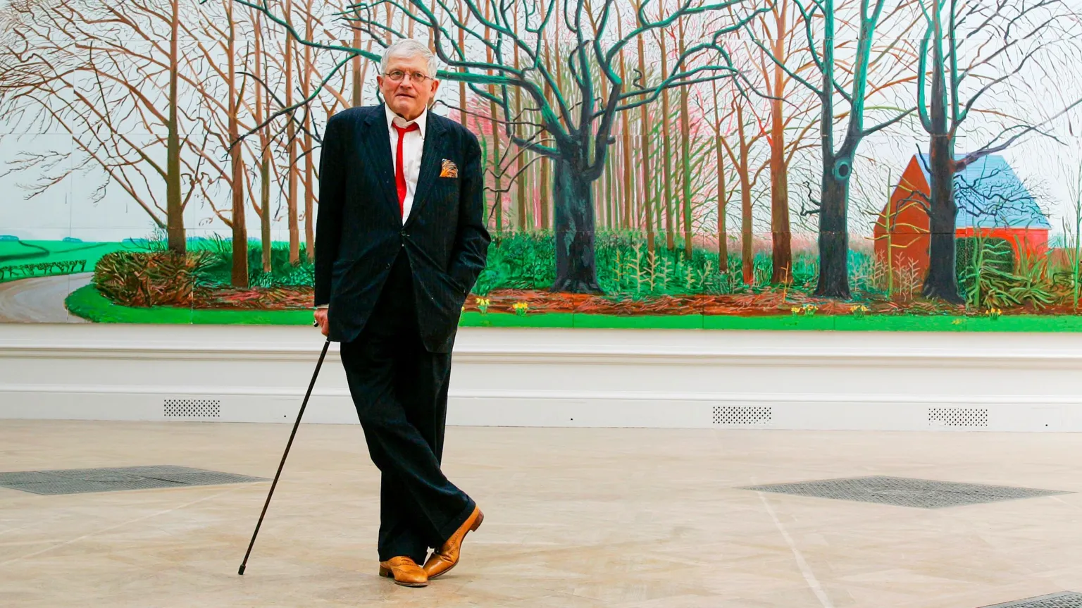 AP British artist David Hockney poses as he unveils his painting 'Bigger Trees Near Water', the largest painting ever shown at the Royal Academy's Summer Exhibition, London, Friday, May 25, 2007.