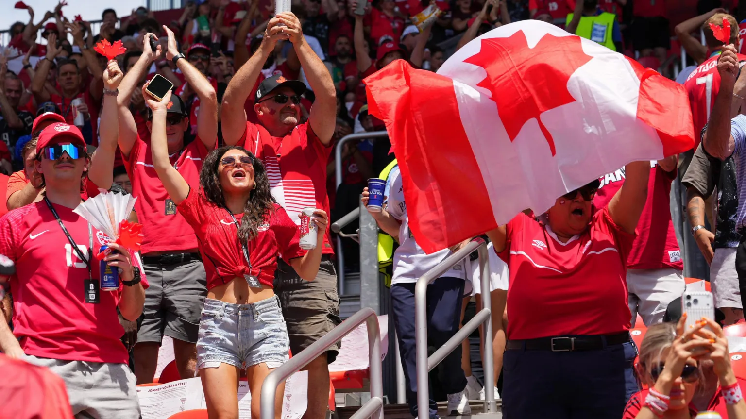 IMAGN IMAGES/ Canada fans inside the stadium waving a flag and cheering